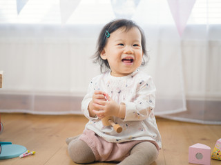 Fototapeta premium cute baby girl play toy at home