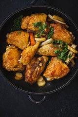Fried chicken stew. Skillet Fried chicken with vegetable. Crispy fried chicken meat. Top view. 