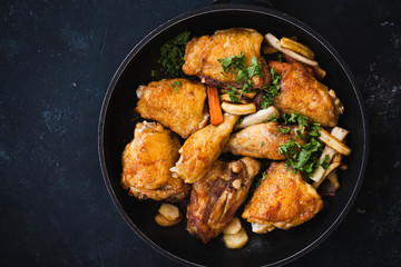 Fried chicken stew. Skillet Fried chicken with vegetable. Crispy fried chicken meat. Top view. 