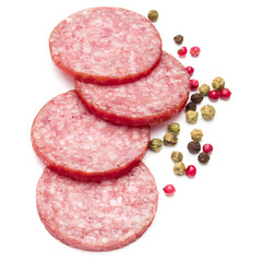 Salami smoked sausage slices and peppercorns isolated on white background cutout