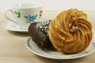 homemade chocolate cake and cup on a wooden table
