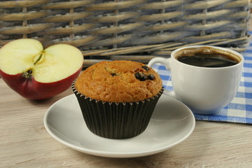 Chocolate muffins with a Cup of coffee on the table