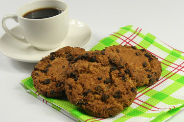 Coffee cup with oatmeal cookie chocolate on wooden background