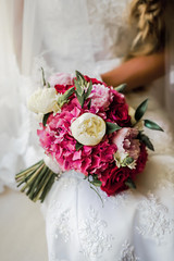 Bride holding delicate marriage bouquet