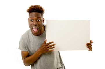 black afro american man smiling happy and showing a blank billboard with copy space