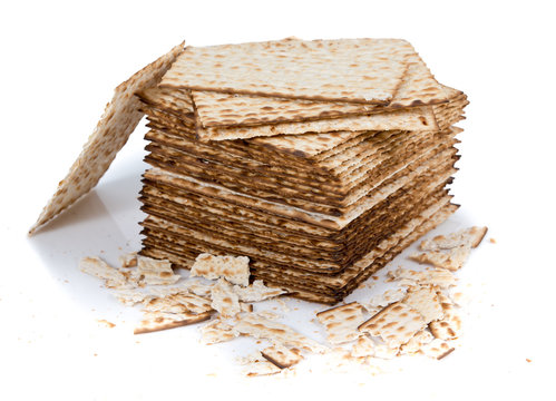 Pile of matza and some broken matza at the side - Traditional kosher bread for Passover