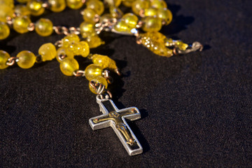 rosary on blackground with free space