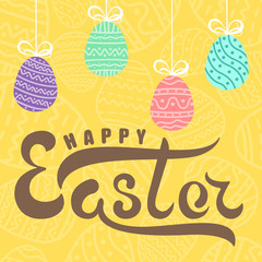 Handwritten lettering happy easter on background yellow easter egg with ornament