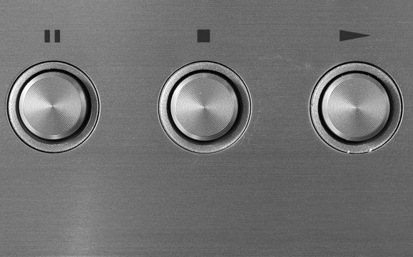 Aluminum play, stop and pause buttons of CD player