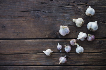 Garlic cloves on wooden old natural vintage background
