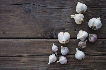 Garlic cloves on wooden old natural vintage background