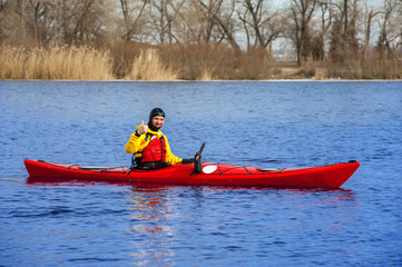man kayaking on the red kayak on the river 15