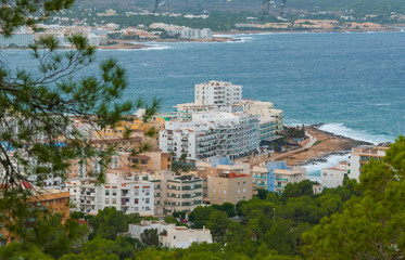 Naklejka premium View from the hills in St Antoni de Portmany & surrounding area in Ibiza. Clearing November day in the bay. Islands near Spain. Resort hotels along the beaches.