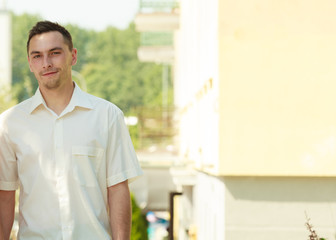 Obraz premium Man in elegant white summer shirt outside.