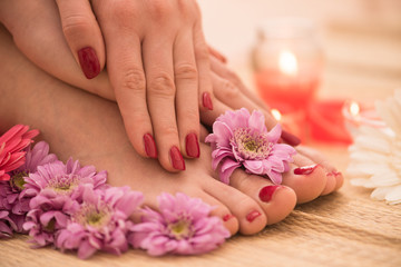 Fototapeta na wymiar female feet and hands at spa salon