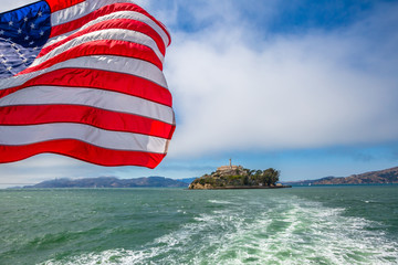 Alcatraz island in San Francisco Bay skyline, California, United States. Sea view from boat to...