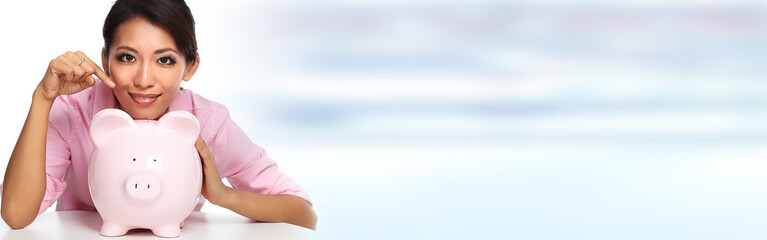 Young asian woman with a piggy bank.