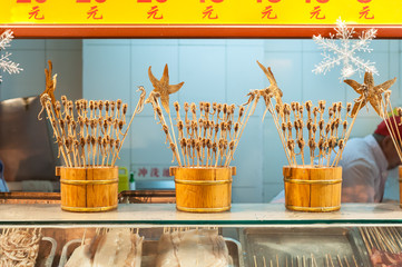 Scorpions on sticks and other weird snacks at Wangfujing snack street, Beijing