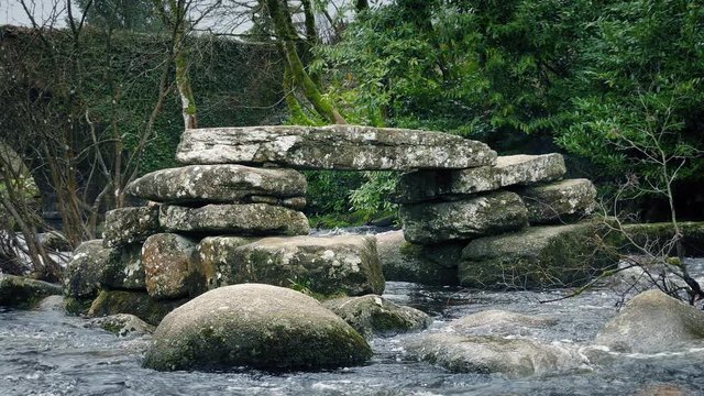 Ancient Stone Bridge Ruins In The River