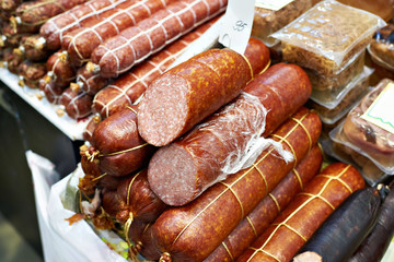 Smoked sausage on counter of grocery store