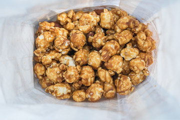 Close up caramel popcorn in paper box 