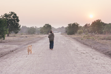 Friendship Woman and dog golden walking