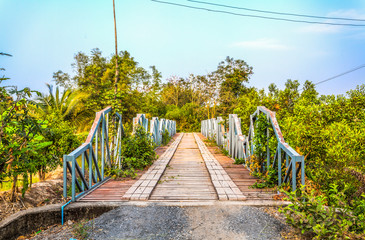 wooden bridge across canal