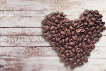 Coffee beans in form of number eight and orchids on beautifull background. International women's day. 8th march