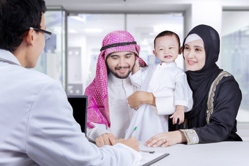 Arabian family waiting a prescription in the hospital