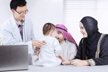 Child examined by a pediatrician at the clinic