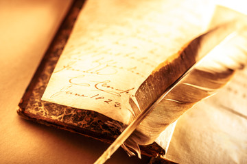 Old book with feather pen