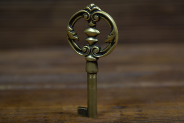 Old key vintage on wood background 