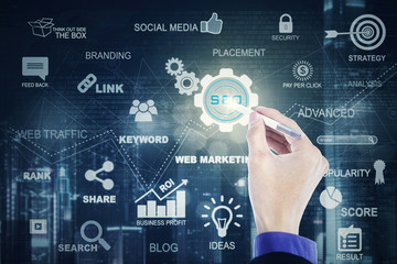 Hand with stylus pen and SEO icon