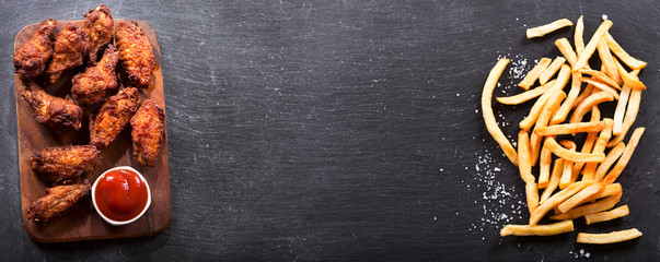 fried chicken with ketchup and french fries