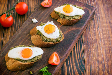 Sandwich With Fried Eggs and Pesto Sauce