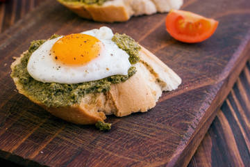Sandwich With Fried Eggs and Pesto Sauce