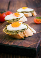 Sandwich With Fried Eggs and Pesto Sauce