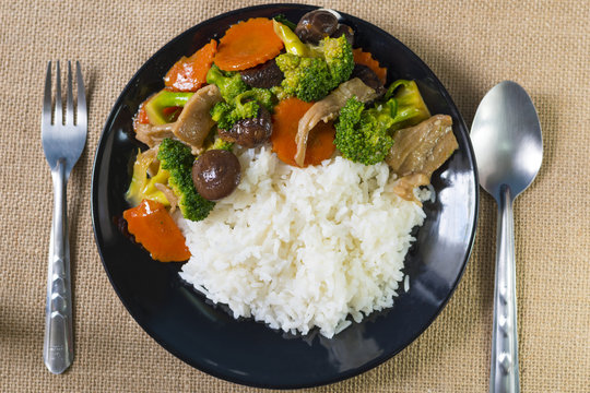 Rice and mixed vegetables in oyster sauce