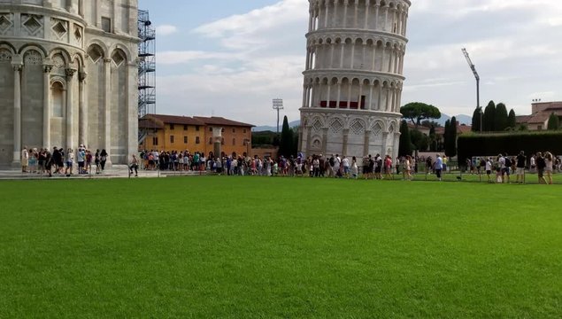 Leaning Tower Pisa. Tourists walk around and take pictures of the tower