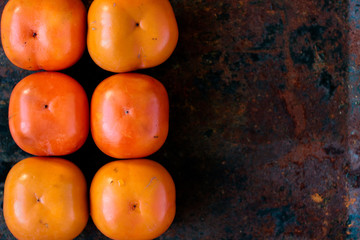 Persimmon fruit background.
