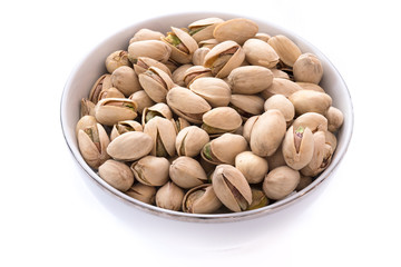 Pistachio nut on white bowl