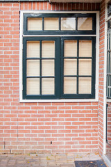 Fototapeta na wymiar photo of beautiful cool windows with jalousie on one of buildings
