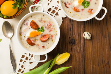 Traditional Polish white borsch with Easter decoration