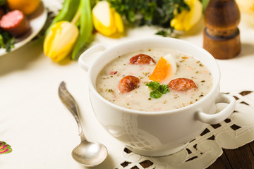 Traditional Polish white borsch with Easter decoration