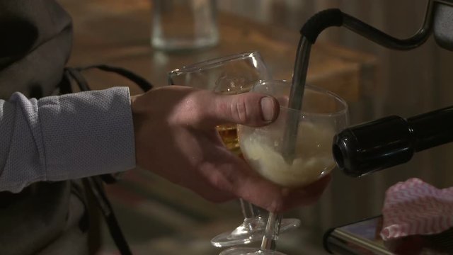 Making coffee in electric coffe machine in a cafe