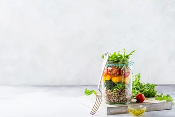 Papier Peint photo Plats de repas Homemade salad in glass jar with quinoa and vegetables. Healthy food, diet, detox, clean eating and vegetarian concept with copy space.