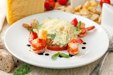 Caesar salad with tiger shrimps and Parmesan cheese