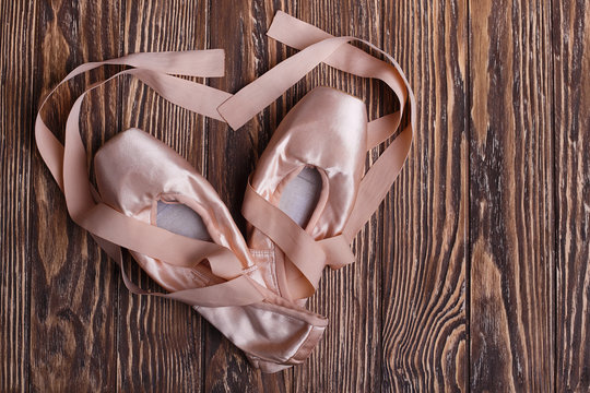 Ballet Shoes On Wooden Background