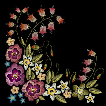 Embroidery flowers concept. Beautiful camomiles, cornflowers, classical embroidery on black background