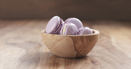 bowl with lavender violet macarons on table, 4k photo